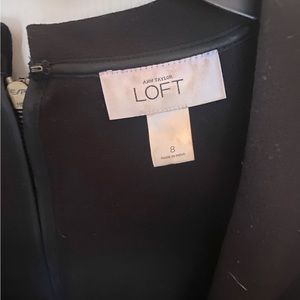 Black knee length dress.